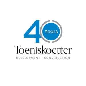 toeniskoetter-development-and-construction-anniversary-logo-(big-40)